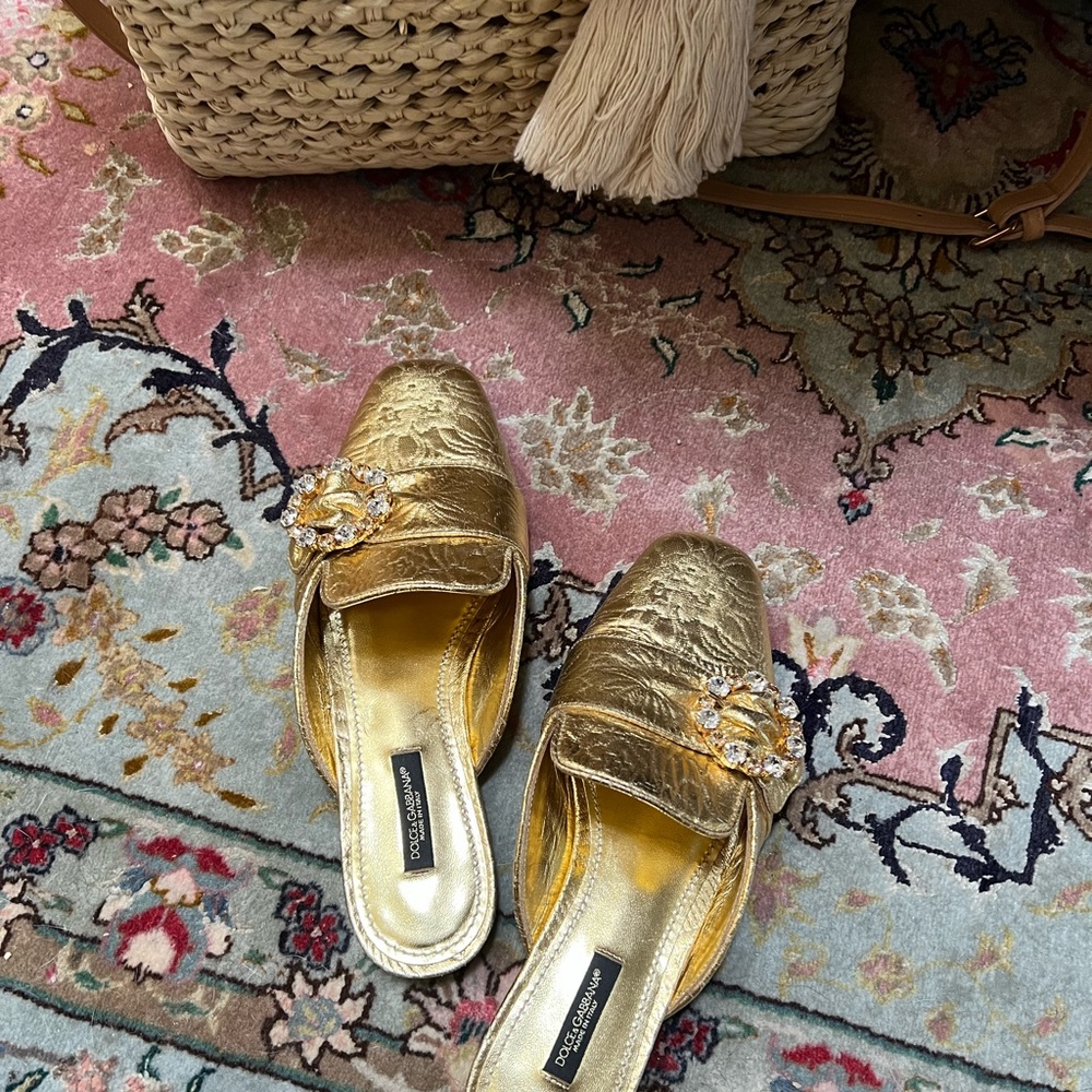 Dolce and Gabbana golden mules with Swarovski crystal buckle